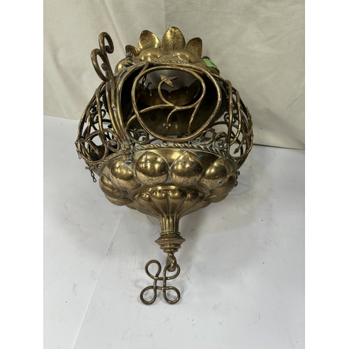 180 - A Middle Eastern brass ceiling candle holder/light.