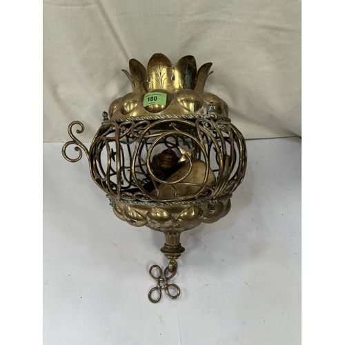 180 - A Middle Eastern brass ceiling candle holder/light.