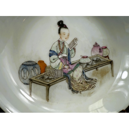 540B - A Chinese shallow dish decorated with central seated and robed figure, reading, turquoise outer rim ... 