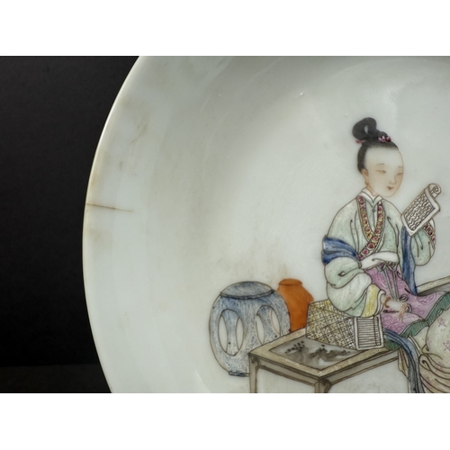 540B - A Chinese shallow dish decorated with central seated and robed figure, reading, turquoise outer rim ... 