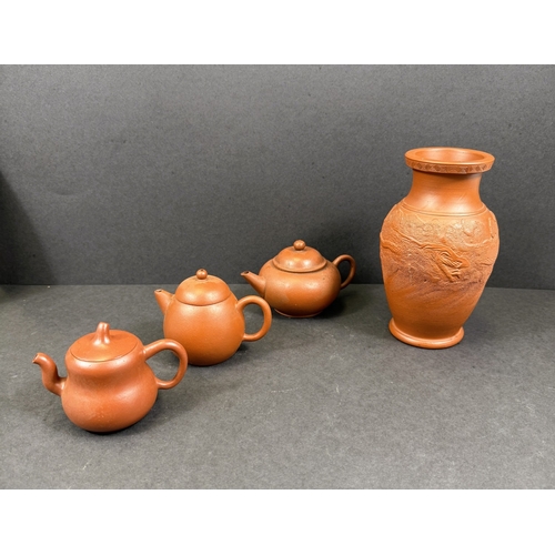 540E - Three Chinese traditional Yixing terracotta teapots; a similar Yixing terracotta baluster vase with ... 