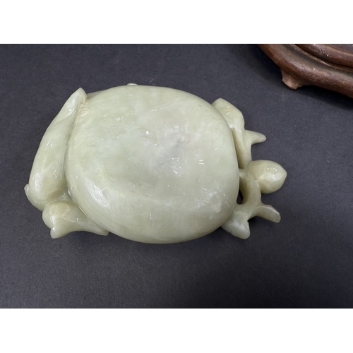 540J - A Chinese carved jade lotus flower brush wash pot with animal and fruiting branch detail, w. 12cm, 1... 