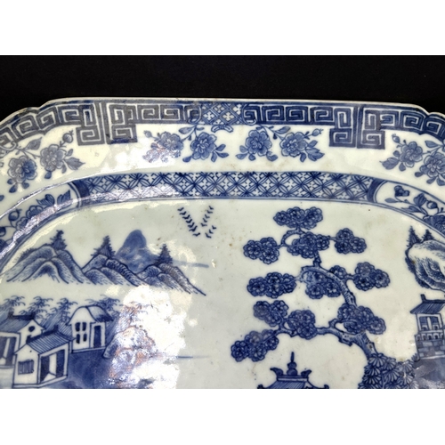 546 - A 19th century Chinese Nanking porcelain blue and white serving dish, 37cm (chips to right hand side... 