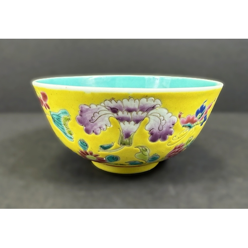 552 - A Chinese porcelain bowl, 19th century, naturalistic decoration on yellow ground, 11cm diameter