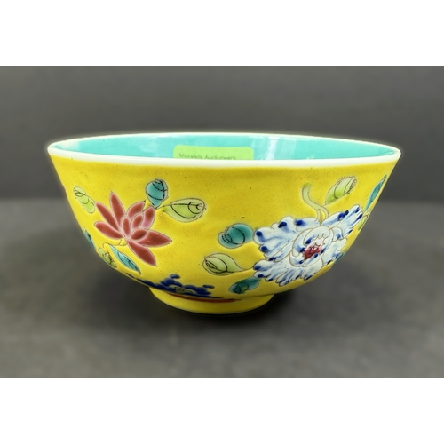 552 - A Chinese porcelain bowl, 19th century, naturalistic decoration on yellow ground, 11cm diameter