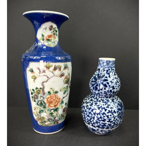 554 - A Chinese porcelain double gourd vase, 19th century, underglaze blue decoration, 13cm; another vase ... 