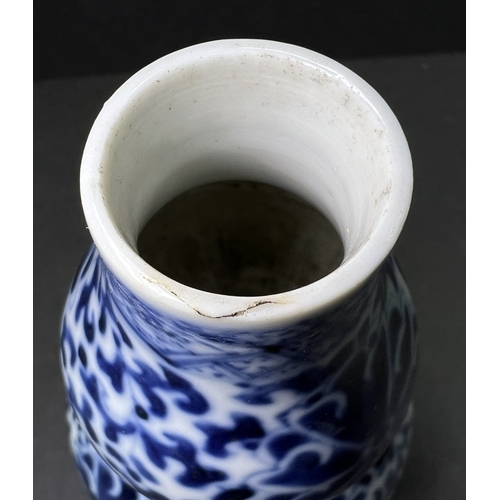 554 - A Chinese porcelain double gourd vase, 19th century, underglaze blue decoration, 13cm; another vase ... 