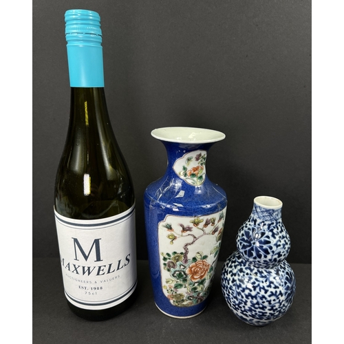 554 - A Chinese porcelain double gourd vase, 19th century, underglaze blue decoration, 13cm; another vase ... 