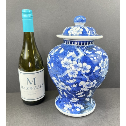 555 - A Chinese porcelain covered jar, 19th century, inverted baluster form, decorated with peonies, 29cm ... 