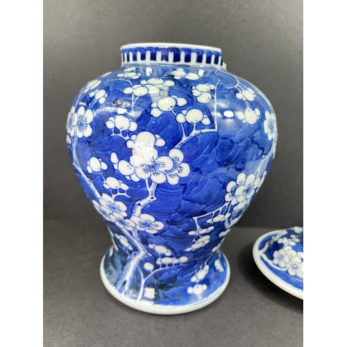 555 - A Chinese porcelain covered jar, 19th century, inverted baluster form, decorated with peonies, 29cm ... 