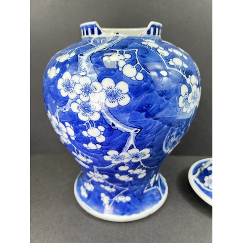 555 - A Chinese porcelain covered jar, 19th century, inverted baluster form, decorated with peonies, 29cm ... 