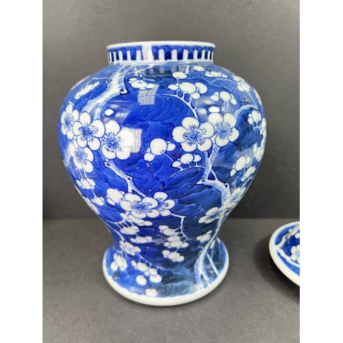 555 - A Chinese porcelain covered jar, 19th century, inverted baluster form, decorated with peonies, 29cm ... 