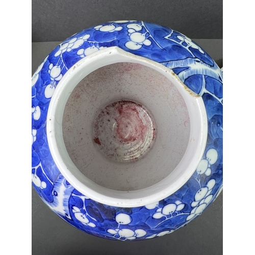 555 - A Chinese porcelain covered jar, 19th century, inverted baluster form, decorated with peonies, 29cm ... 