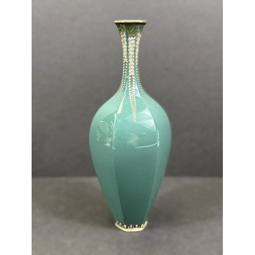 557 - A Japanese hexagonal cloisonné vase, early 20th century, white metal with trailing floral decoration... 