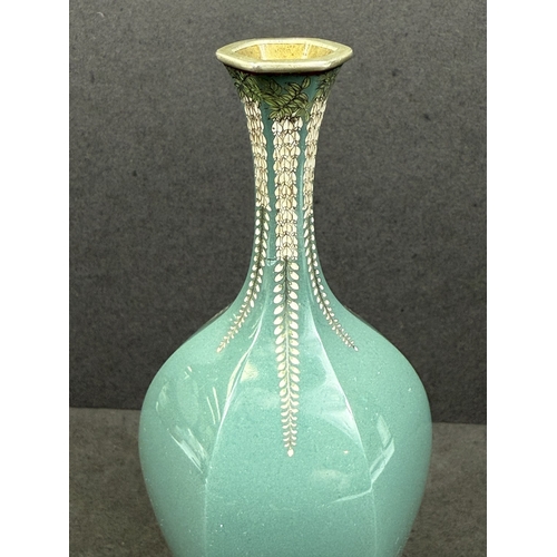 557 - A Japanese hexagonal cloisonné vase, early 20th century, white metal with trailing floral decoration... 