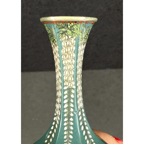 557 - A Japanese hexagonal cloisonné vase, early 20th century, white metal with trailing floral decoration... 