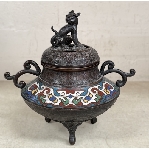 560 - A 19th century Chinese bronze incense burner of squat form carried on three legs, decorated in colou... 