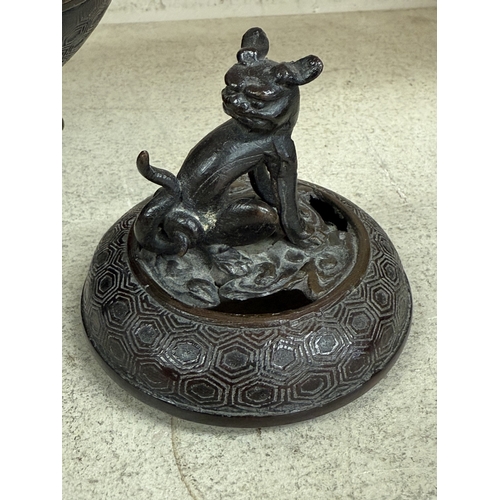 560 - A 19th century Chinese bronze incense burner of squat form carried on three legs, decorated in colou... 