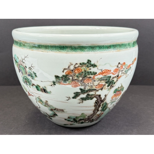 560A - A Chinese famille vert jardiniere with painted decoration of men fishing, trees, landscapes etc. dia... 