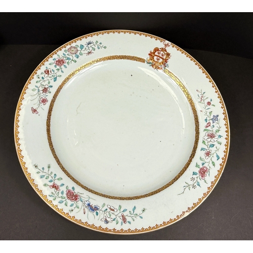560C - An 18th century Chinese Yongzheng period armorial charger, the rim decorated with flowers and leaves... 