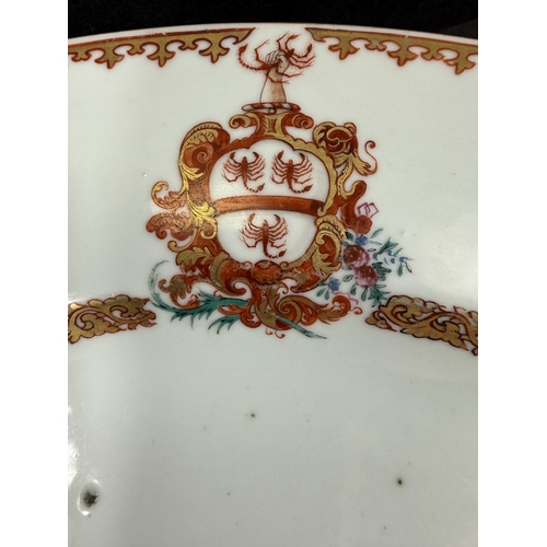 560C - An 18th century Chinese Yongzheng period armorial charger, the rim decorated with flowers and leaves... 