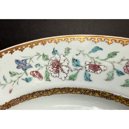 560C - An 18th century Chinese Yongzheng period armorial charger, the rim decorated with flowers and leaves... 