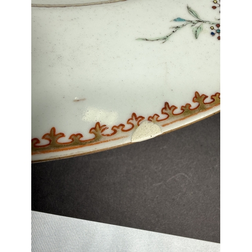 560C - An 18th century Chinese Yongzheng period armorial charger, the rim decorated with flowers and leaves... 