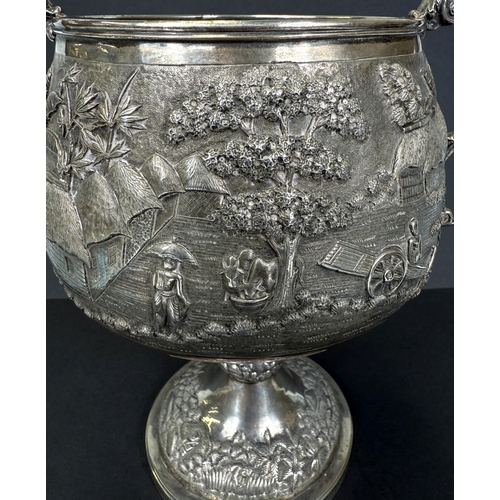 601 - A large late 19th century Indian white metal two-handled pedestal trophy cup with extensive relief d... 