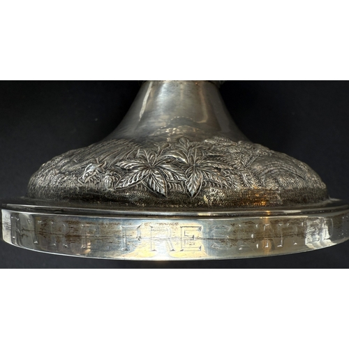 601 - A large late 19th century Indian white metal two-handled pedestal trophy cup with extensive relief d... 