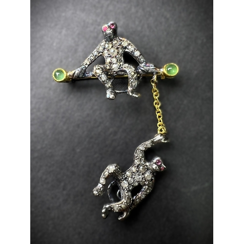 630 - A Victorian design novelty brooch of 2 monkeys, one seated, the other suspended on a chain, diamond ... 