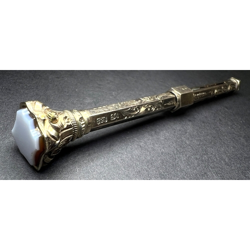 631 - A yellow metal chased and engraved propelling pencil with seal top, stamped 