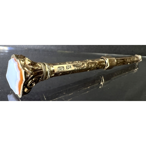 631 - A yellow metal chased and engraved propelling pencil with seal top, stamped 