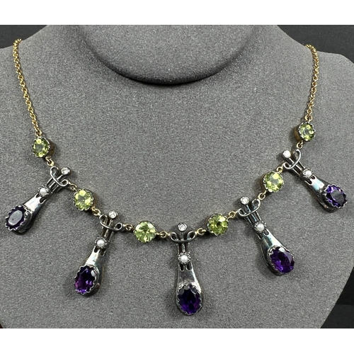 634 - An Art Nouveau style yellow metal necklace with 5 drops each set with an oval amethyst and seed pear... 