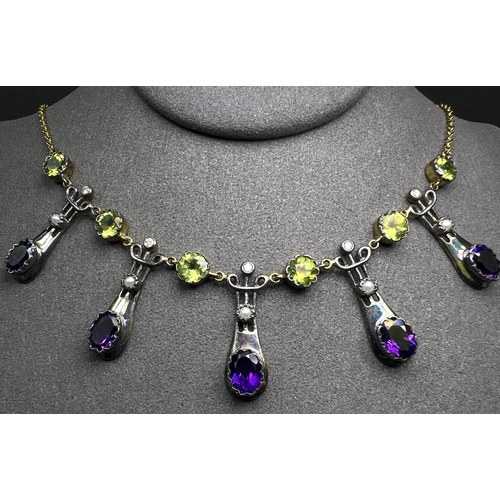 634 - An Art Nouveau style yellow metal necklace with 5 drops each set with an oval amethyst and seed pear... 