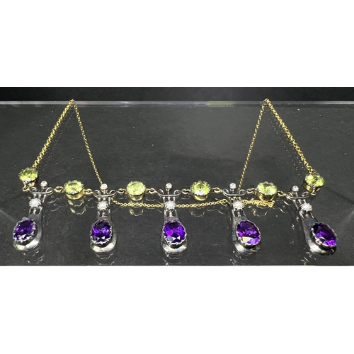 634 - An Art Nouveau style yellow metal necklace with 5 drops each set with an oval amethyst and seed pear... 