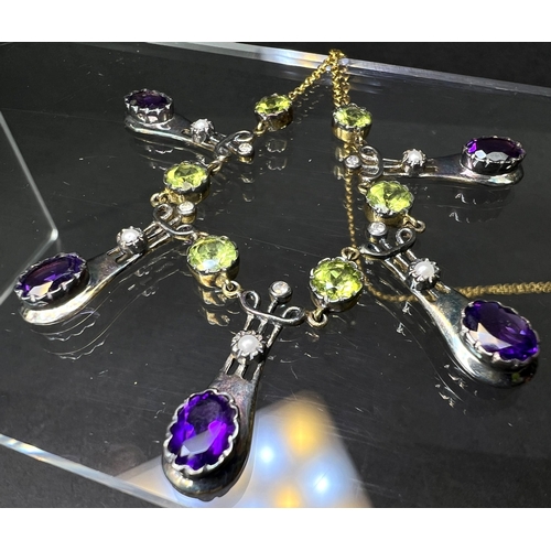 634 - An Art Nouveau style yellow metal necklace with 5 drops each set with an oval amethyst and seed pear... 