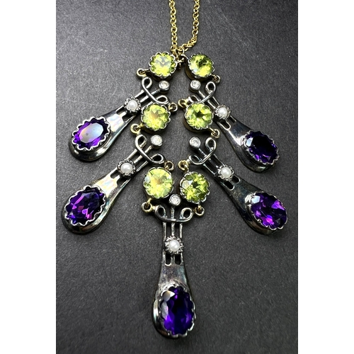 634 - An Art Nouveau style yellow metal necklace with 5 drops each set with an oval amethyst and seed pear... 