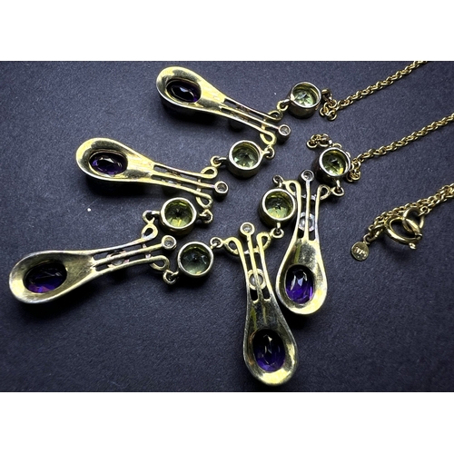634 - An Art Nouveau style yellow metal necklace with 5 drops each set with an oval amethyst and seed pear... 