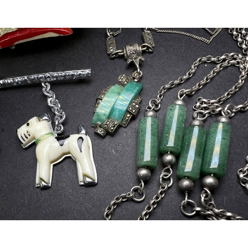 640 - An Art Deco Jadite white metal pendant necklace, a similar Marcasite brooch etc