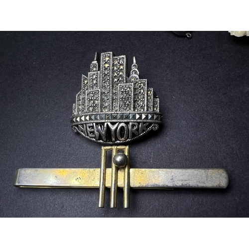 640 - An Art Deco Jadite white metal pendant necklace, a similar Marcasite brooch etc
