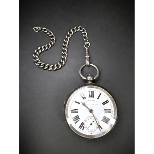 645 - A Heavy hall marked silver cased verge movement open face pocket watch with part Albert chain