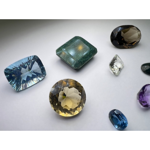650 - A selection of cut and other stones in a variety of colours, untested.