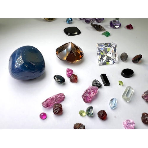 650 - A selection of cut and other stones in a variety of colours, untested.