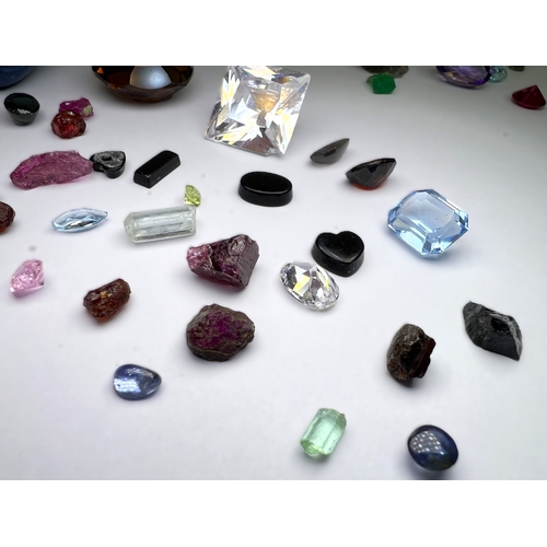 650 - A selection of cut and other stones in a variety of colours, untested.