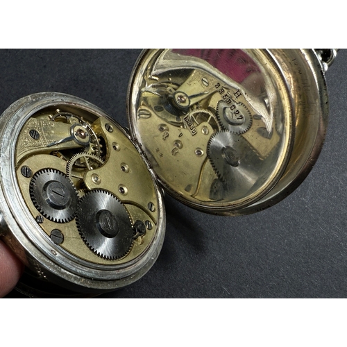 651 - Two silver cased keyless open faced gents pocket watches, one with chain.