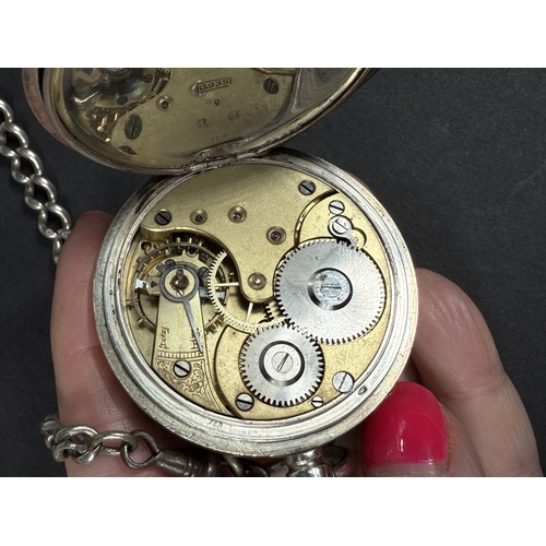651 - Two silver cased keyless open faced gents pocket watches, one with chain.