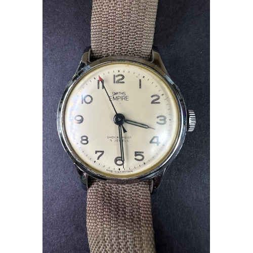 686 - A Smiths Empire Military watch on material strap