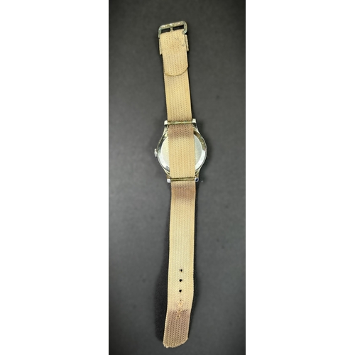 686 - A Smiths Empire Military watch on material strap
