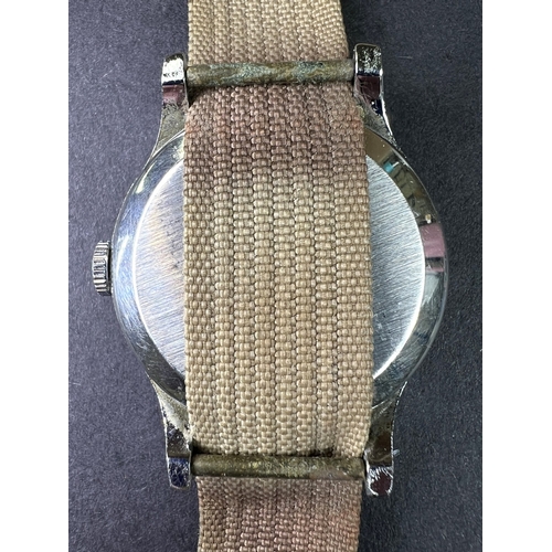 686 - A Smiths Empire Military watch on material strap