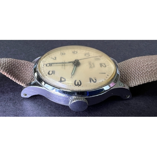 686 - A Smiths Empire Military watch on material strap